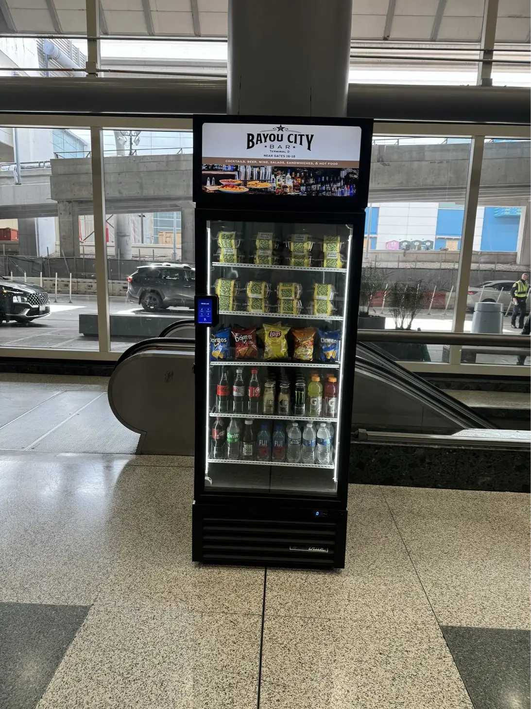 Smart vending machine at airport with premium product selection and digital display